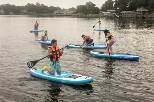 standup paddle board group on the water