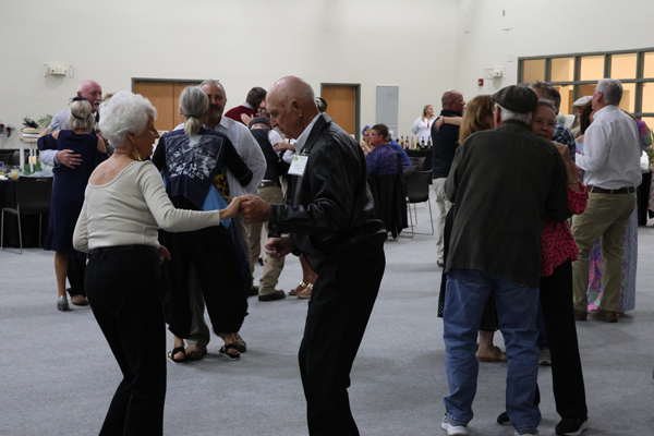 large group dancing while the band plays